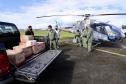 Ação conjunta da Portos do Paraná, Defesa Civil e batalhão aéreo da Polícia Militar entregou cestas básicas em comunidades extremamente isoladas.