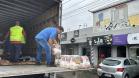 Cestas básicas arrecadadas na Corrida do Porto são distribuídas em Paranaguá