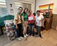 Cestas básicas arrecadadas na Corrida do Porto são distribuídas em Paranaguá