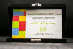 #praquemnaopodever foto de placa dentro da caixa preta aveludada. na plaga esta escrito em em verde "AGENTE DESTAQUE 2025"